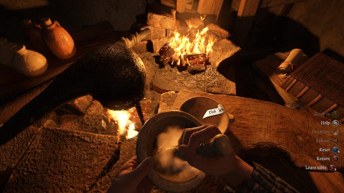 Somebody grinding herbs at an alchemy station in first-person view  in Kingdom Come: Deliverance 2