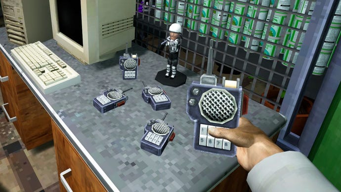 A hand holding a walkie talkie device in co-op game Abiotic Factor.