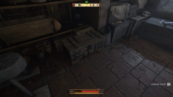 The player in Kingdom Come: Deliverance 2 walks towards a locked chest in a dark castle room.