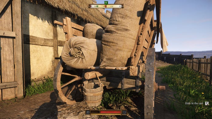 The player in Kingdom Come: Deliverance 2 approaches a cart in Trosky Castle, and a prompt appears to hide inside the cart.