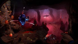 A sharp-toothed fish lunges at the player in a deep cave lit up in red hues.