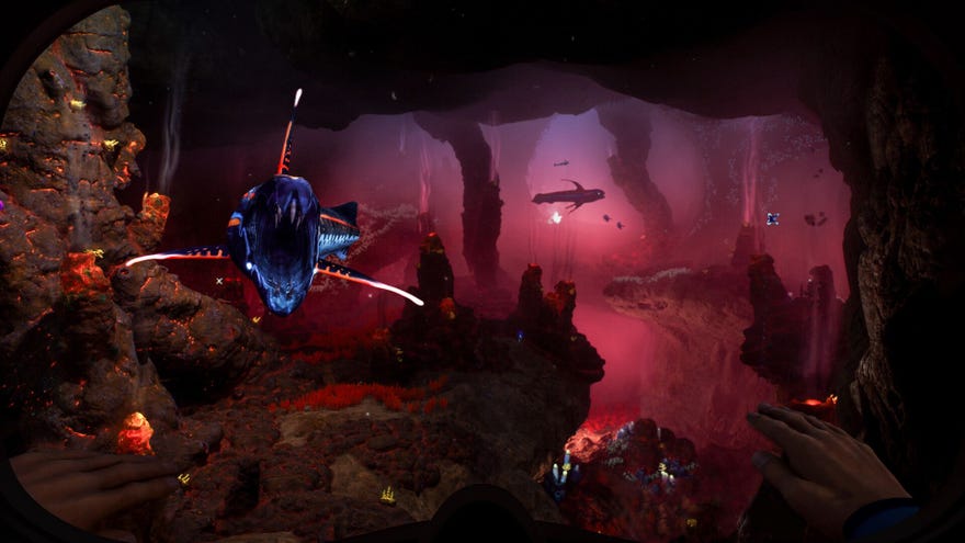 A sharp-toothed fish lunges at the player in a deep cave lit up in red hues.